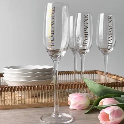 Hot Champagneglass, transparent/gull Borddekking
